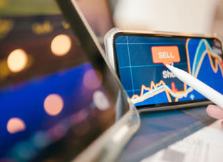 Trader analysing Bitcoin Ethereum and forex options across multiple markets